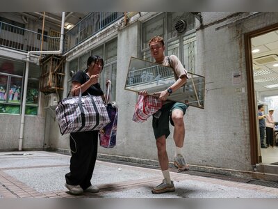 Hong Kong fire survivor returns home to salvage memories from scorched apartment ruins
